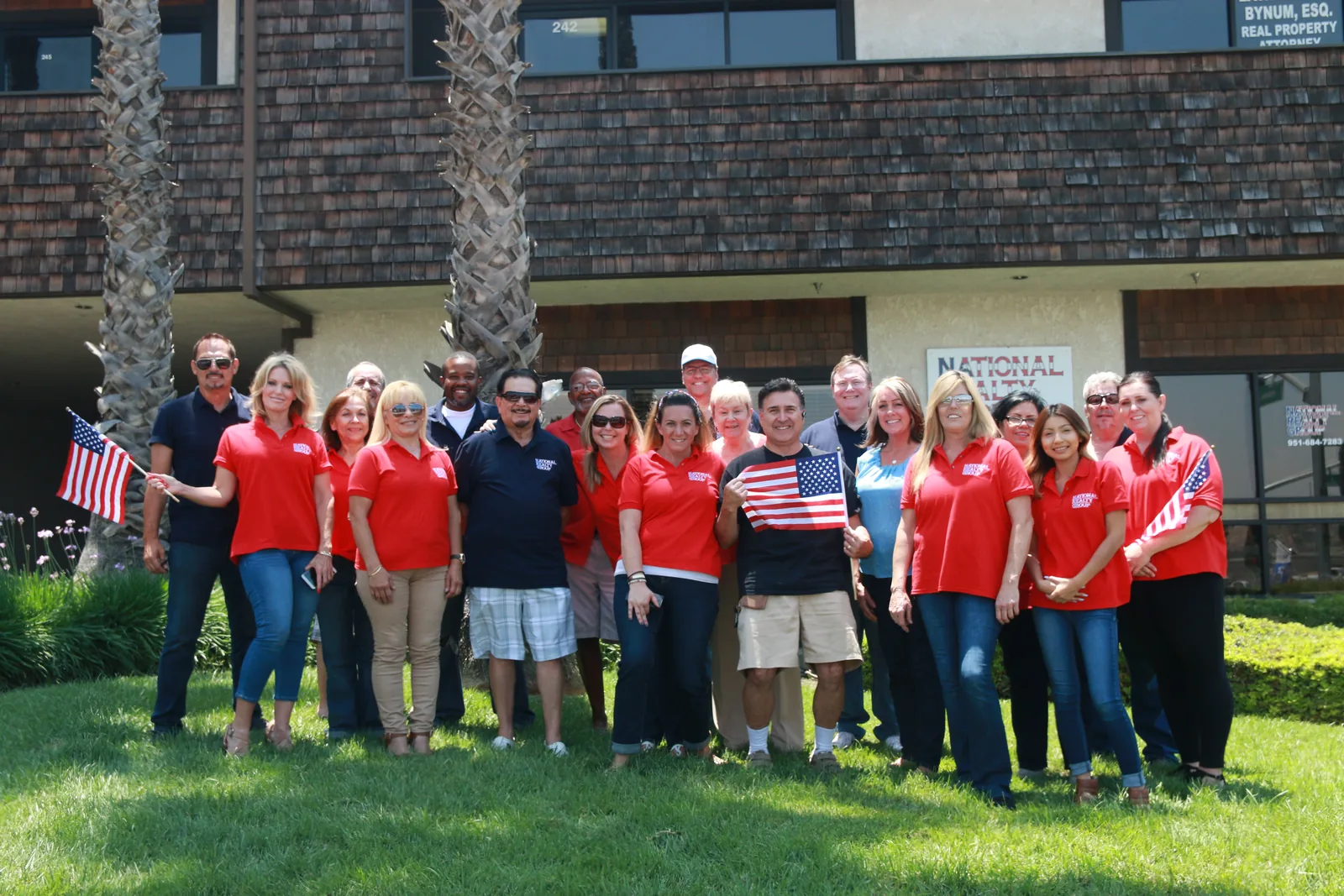 National Realty Group agents outside the firm’s office on Indiana Avenue in Riverside. Not a current or complete roster — see the agent directory for who is with the firm today.