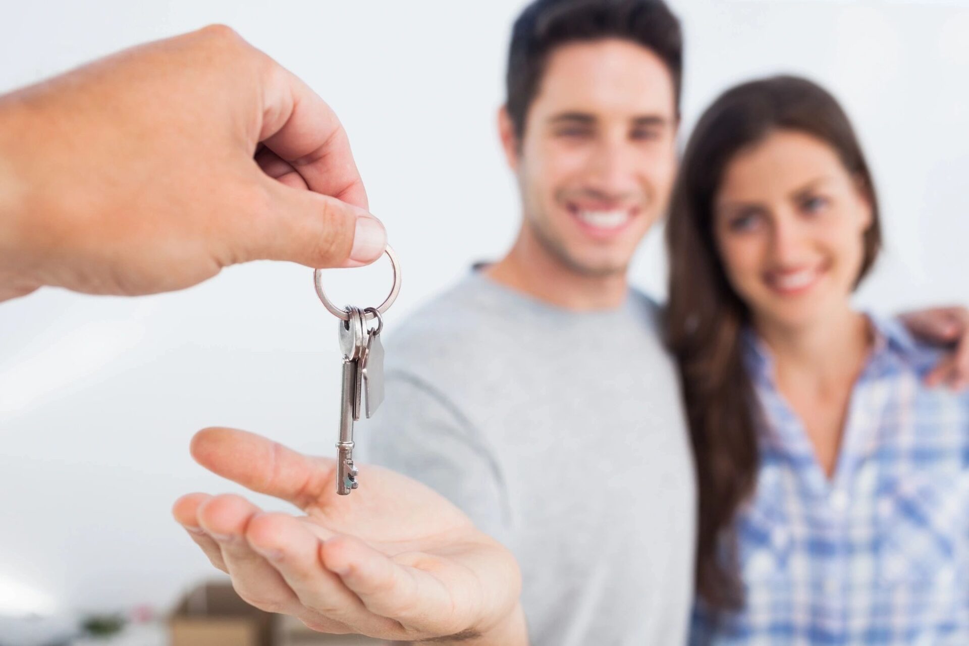 Man with his wife being given a house key